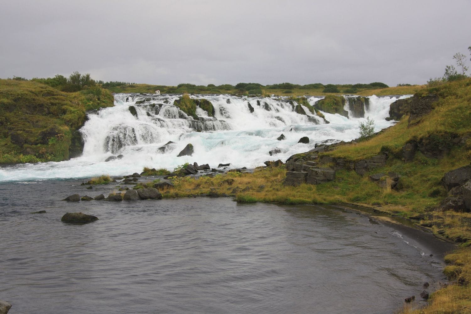 View of a waterwall in a lush green setting