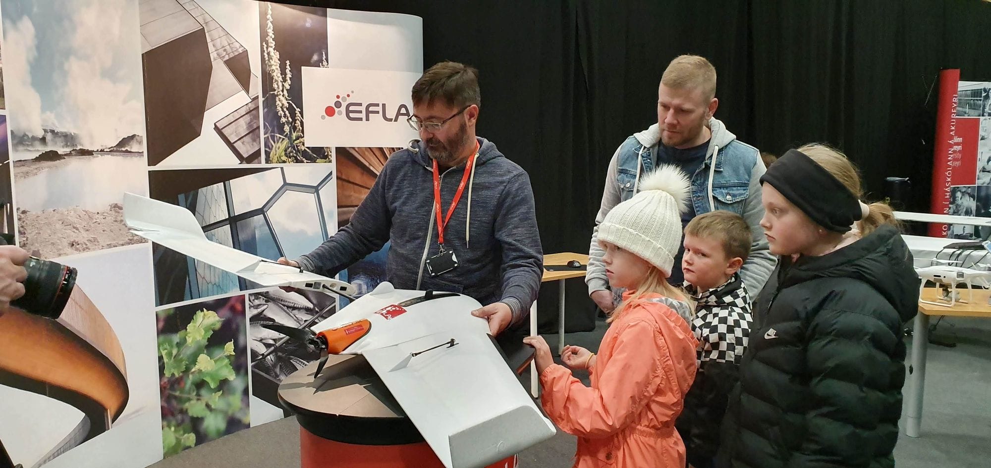 A man demonstrating a drone to an audience 
