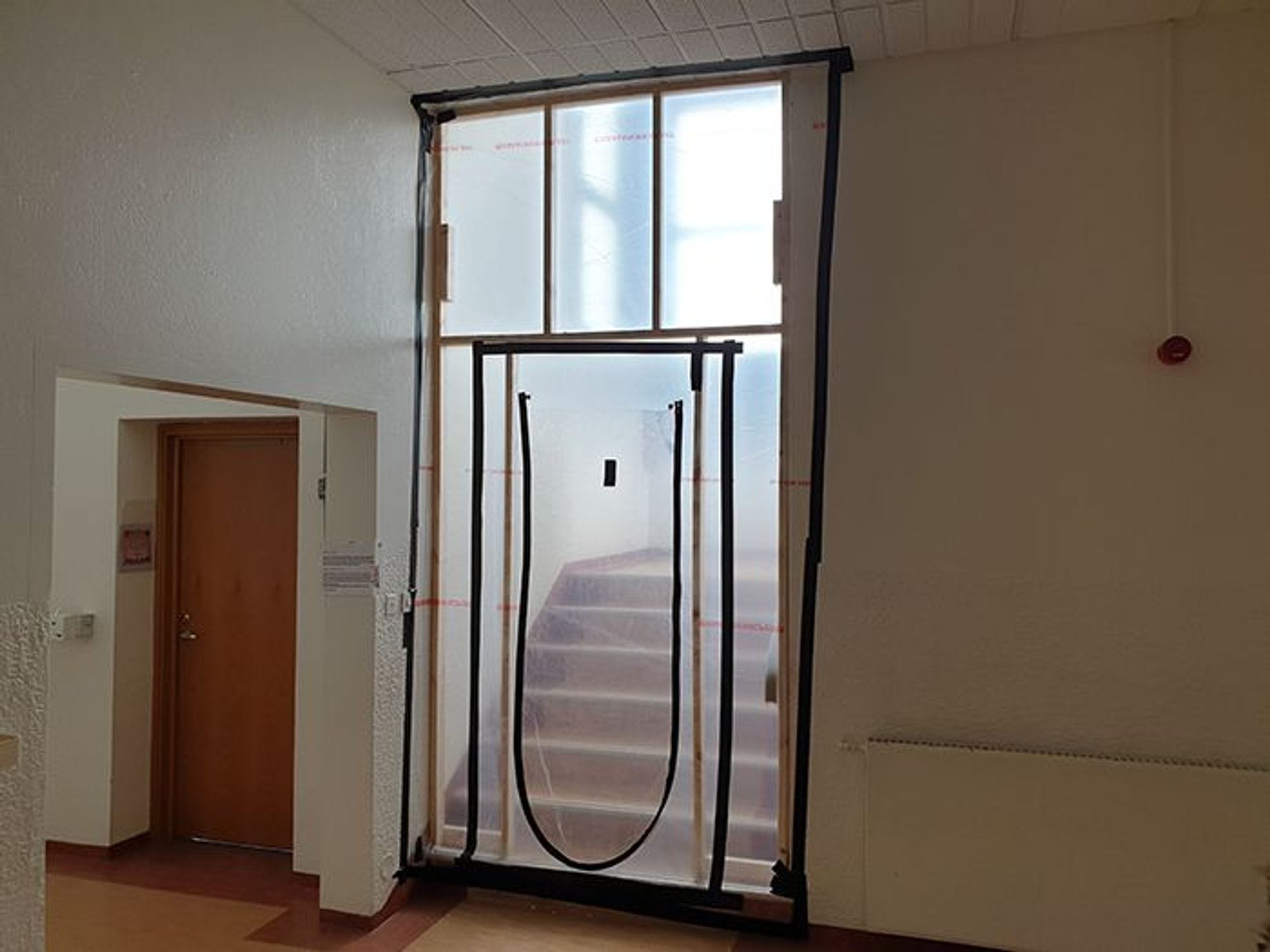 an interior space under construction, with insulation material visible 
