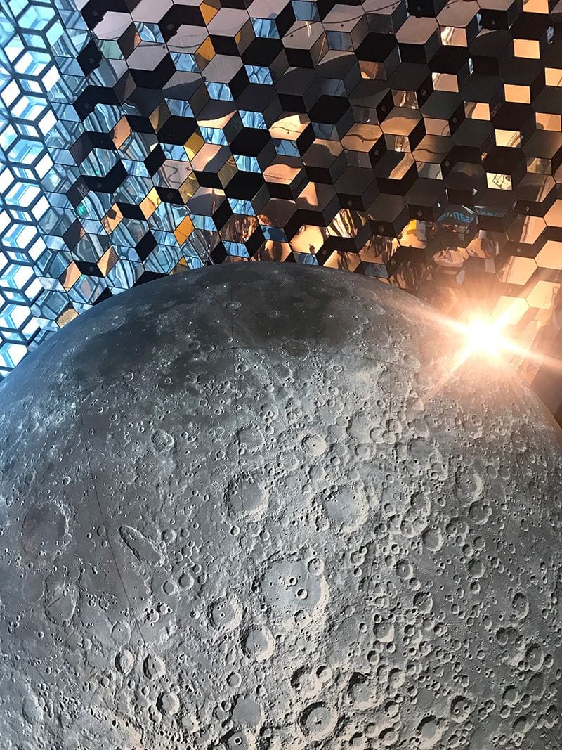 image of half moon with shiny glass structured background