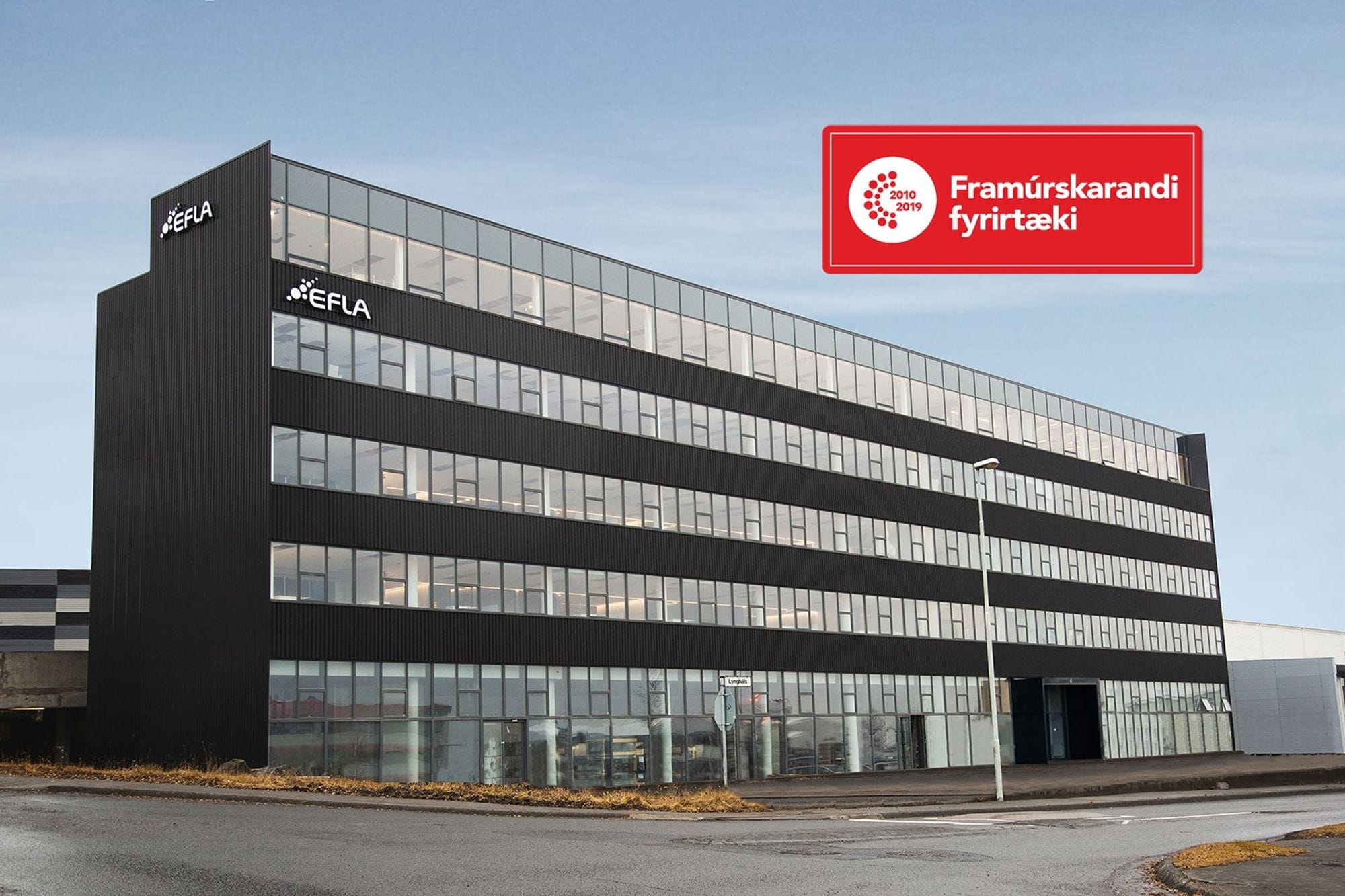 Modern commercial building with some Icelandic text "Framurskarandi fyrirtæki"