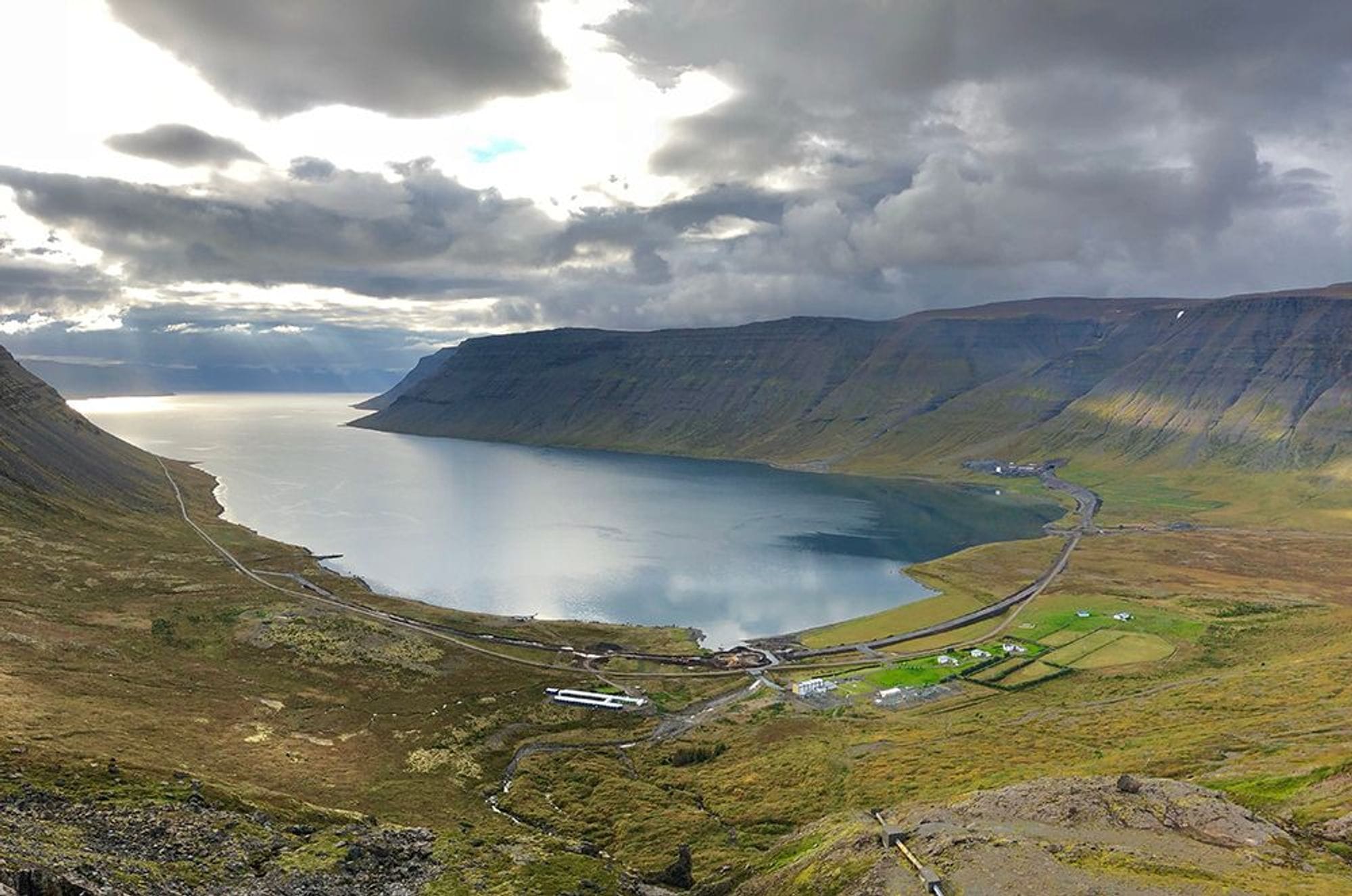 Great view of fjord and mountains in the background of a coastal village