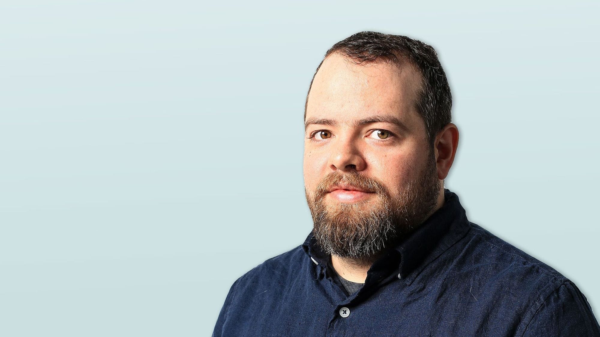 A portrait of a young man with beard