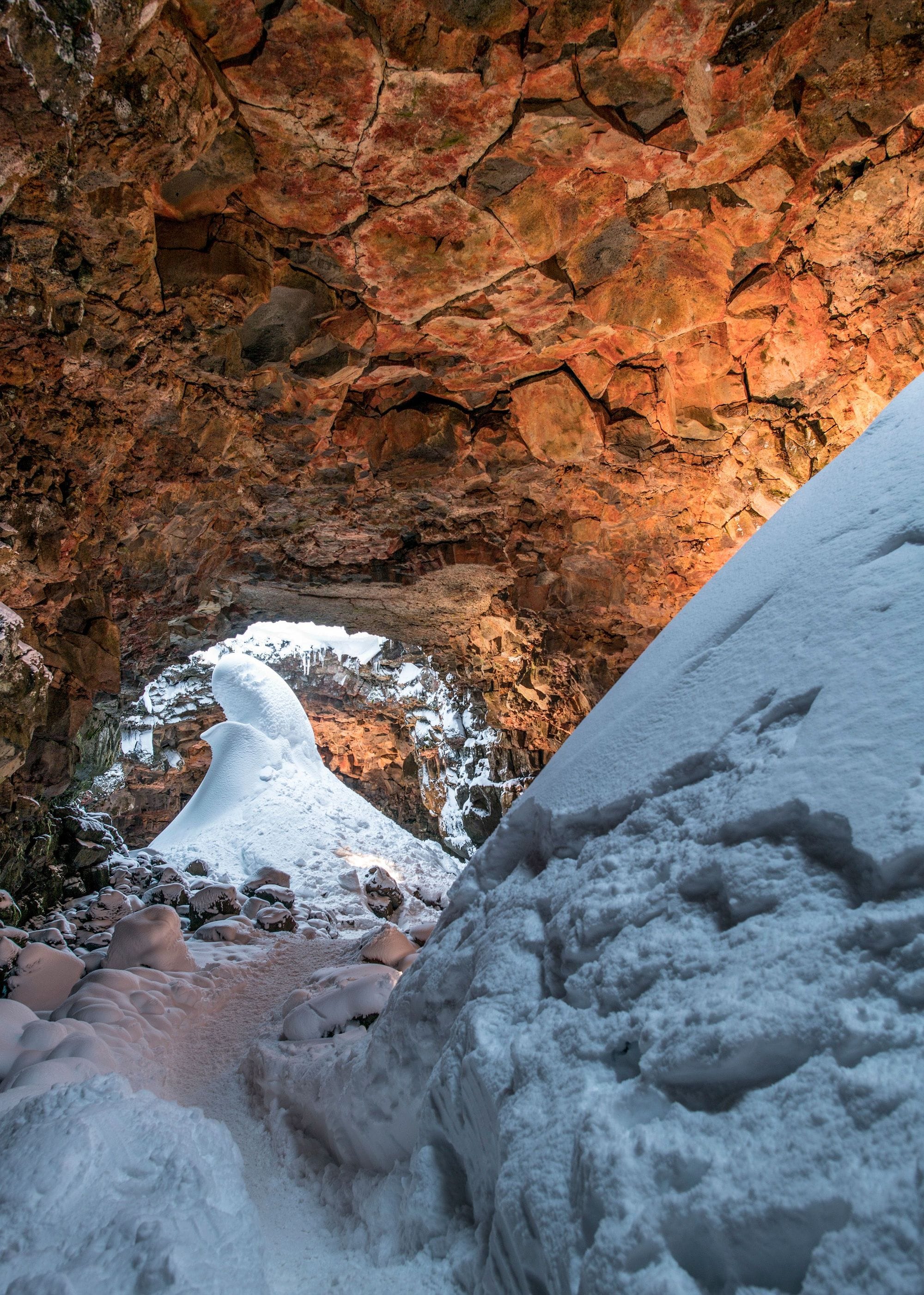 snowy scene with a stream and rocks