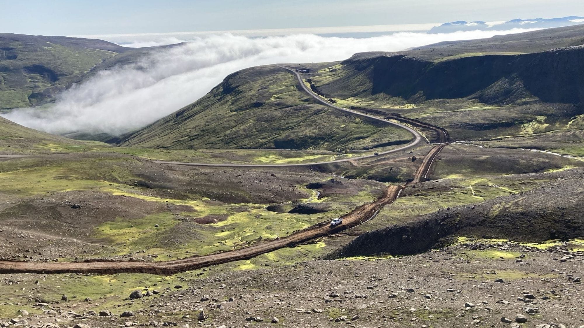A misty mountain road with turns 