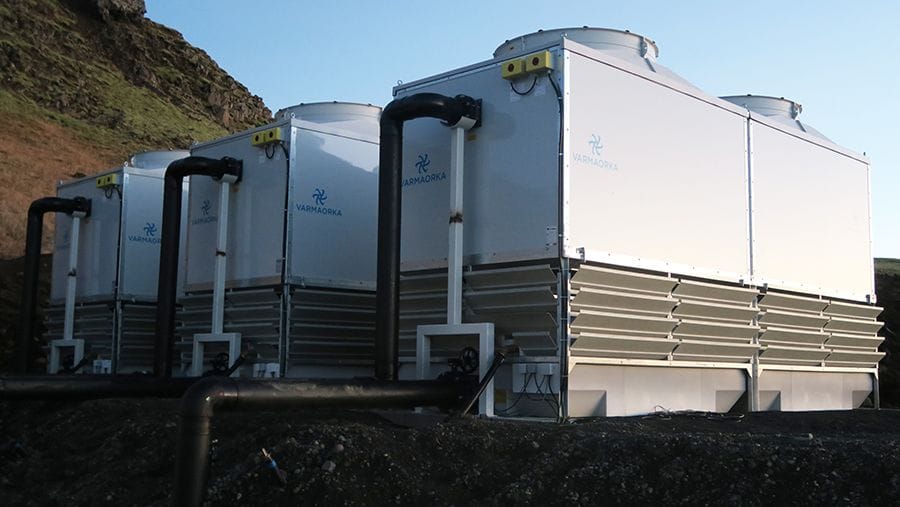 three giant silver industrial equipment