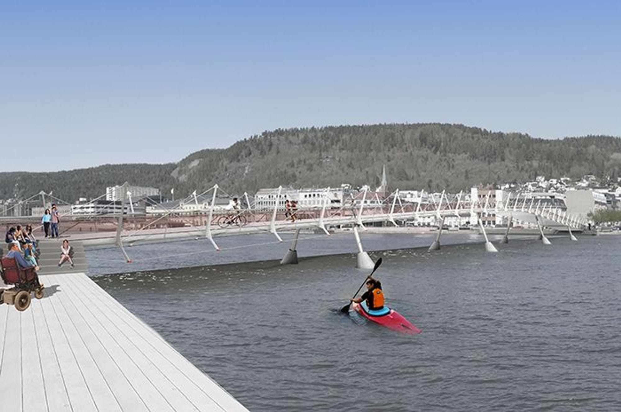 A person kayaking below a pedestrian bridge