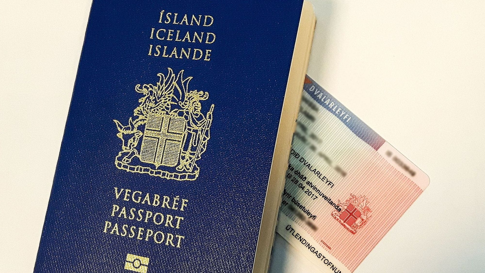 An Icelandic passport and personal identification shown partially