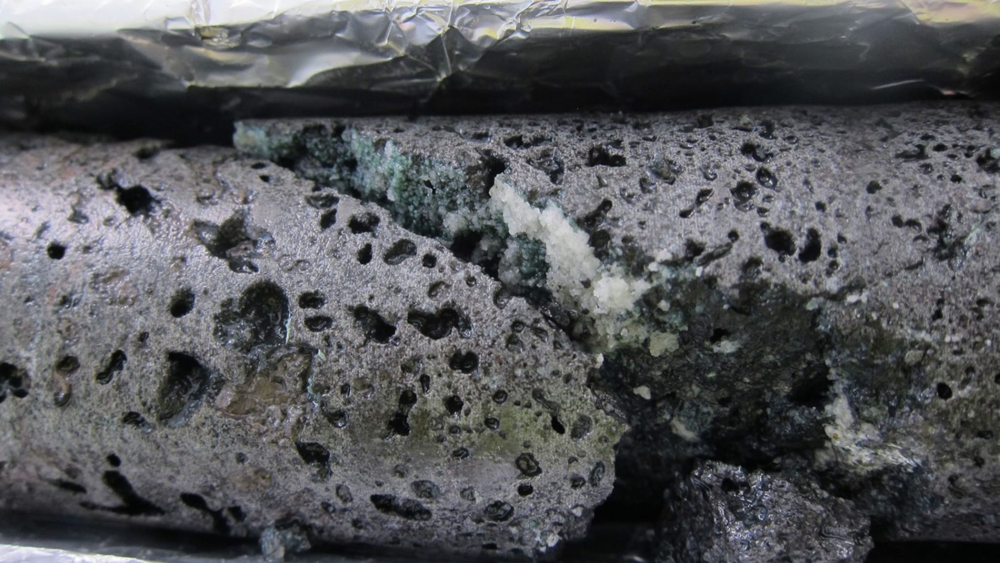The picture shows rocks with various sized holes