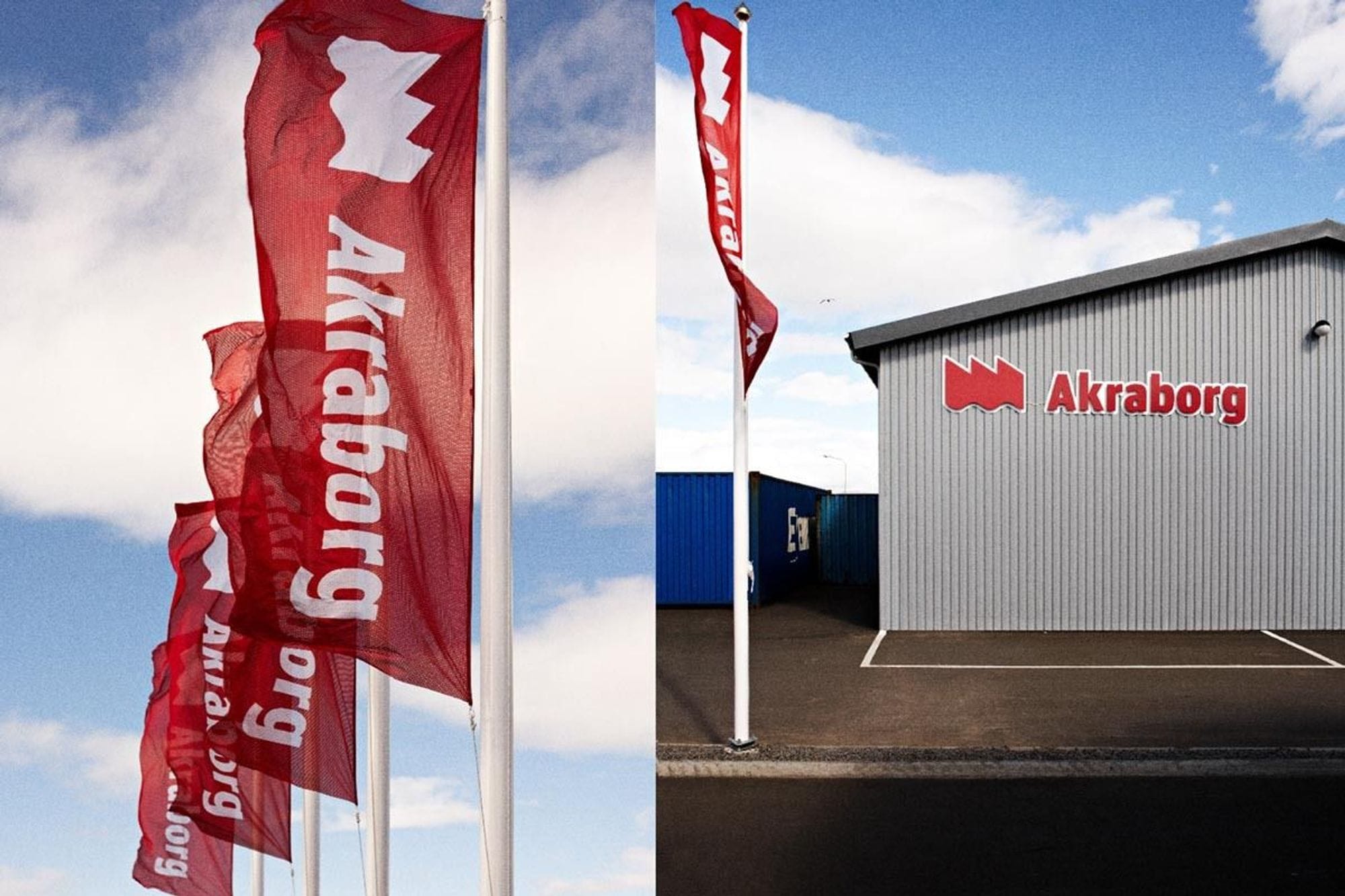 Few red flags fluttering with inscription "Akraborg" and a building also labelled with same text