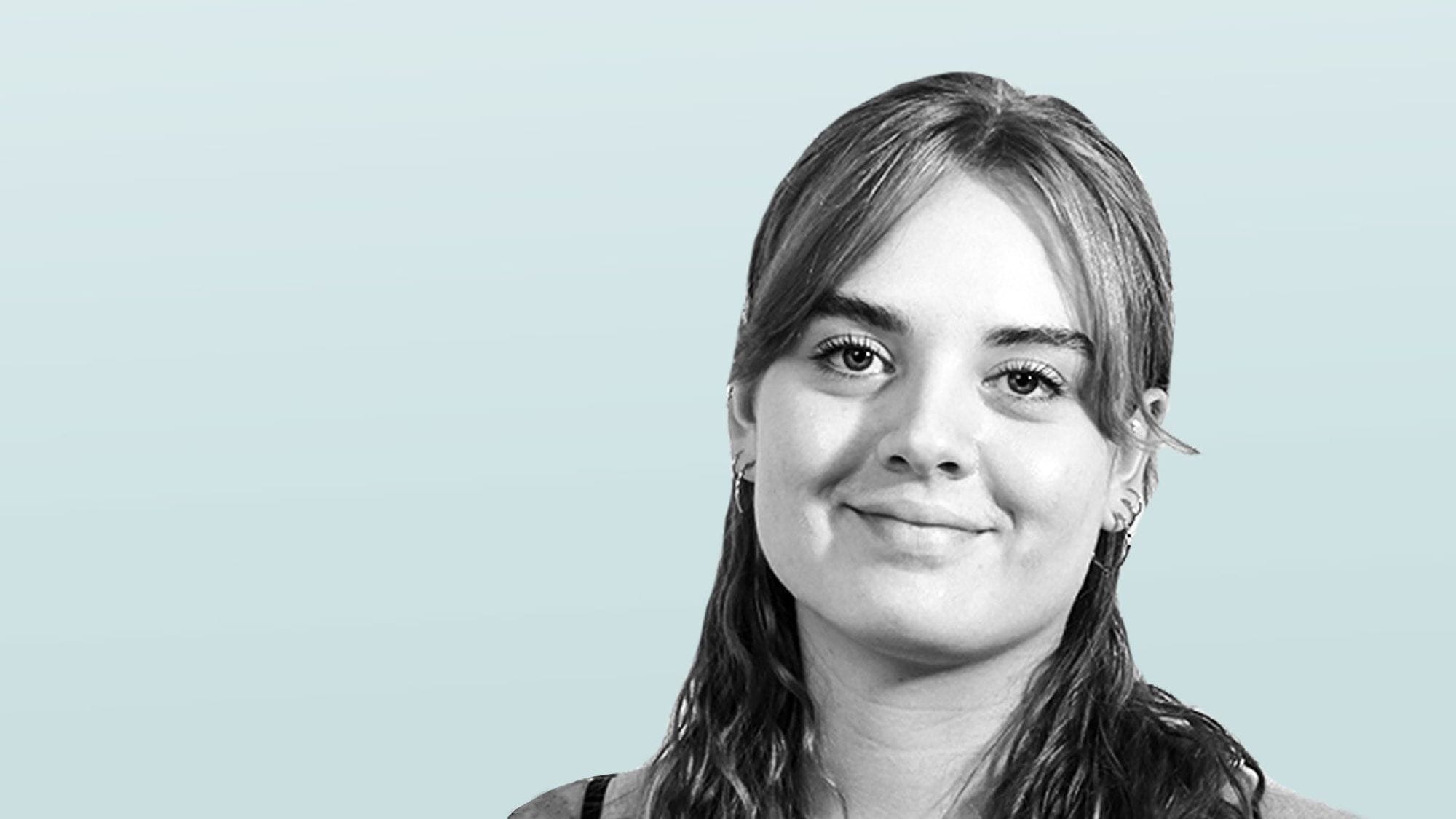 A portrait of a young woman with big smile