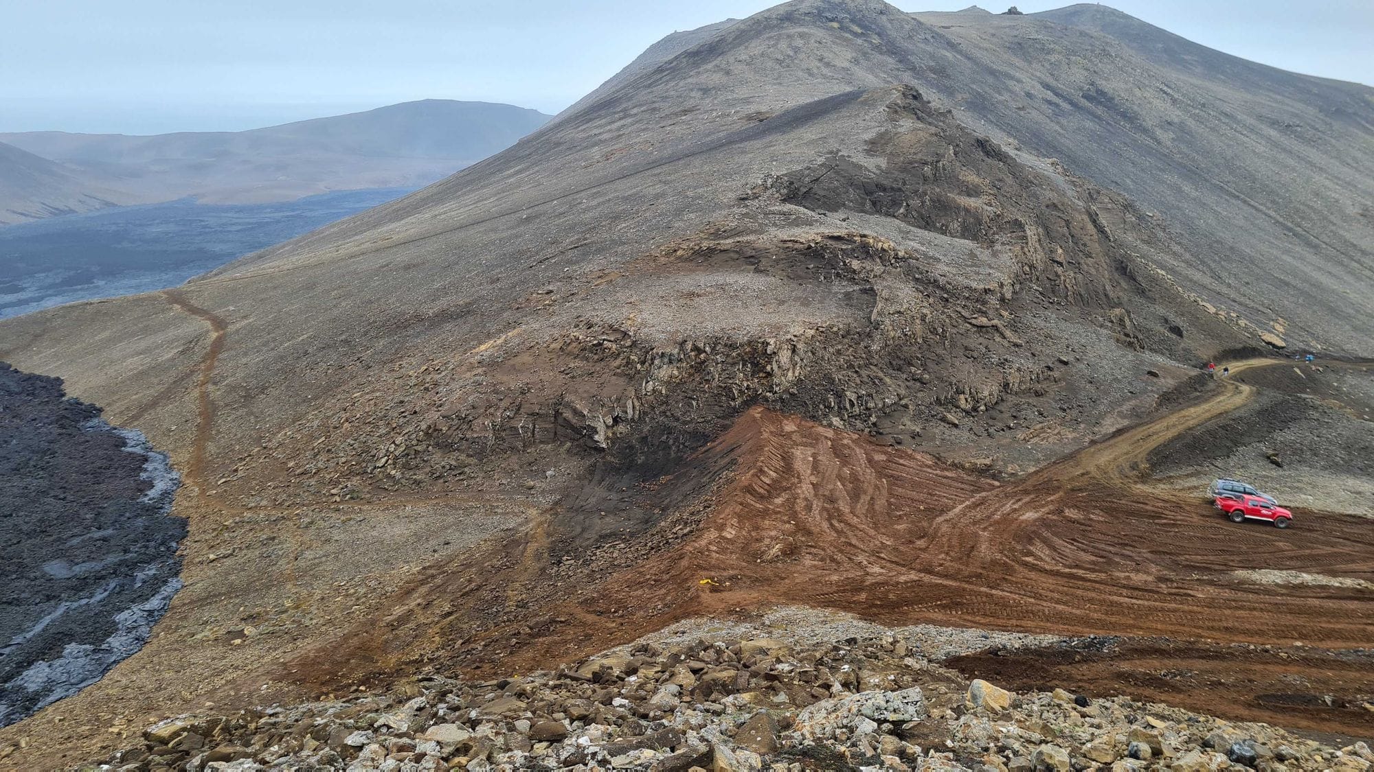 A rugged mountain landscape with a trail