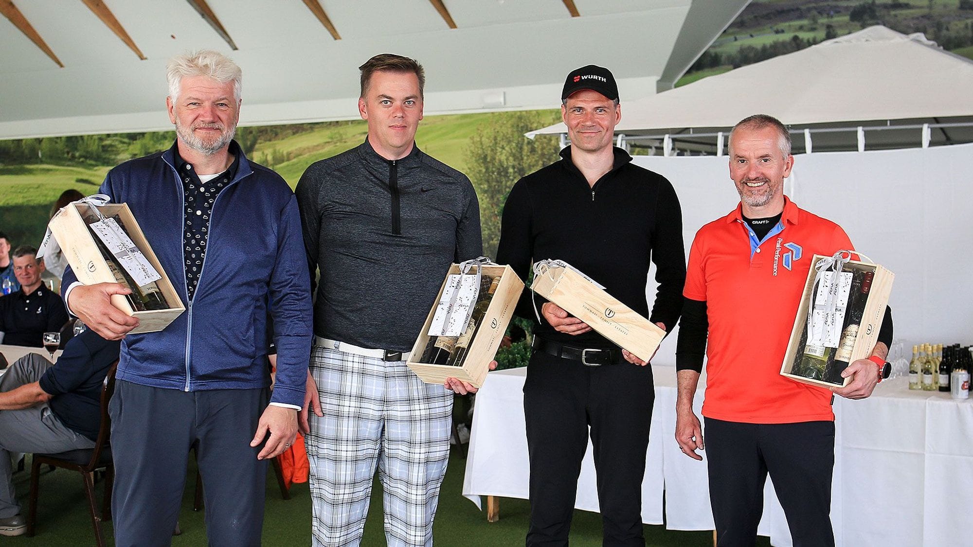 Four men posing with wooden wine boxes