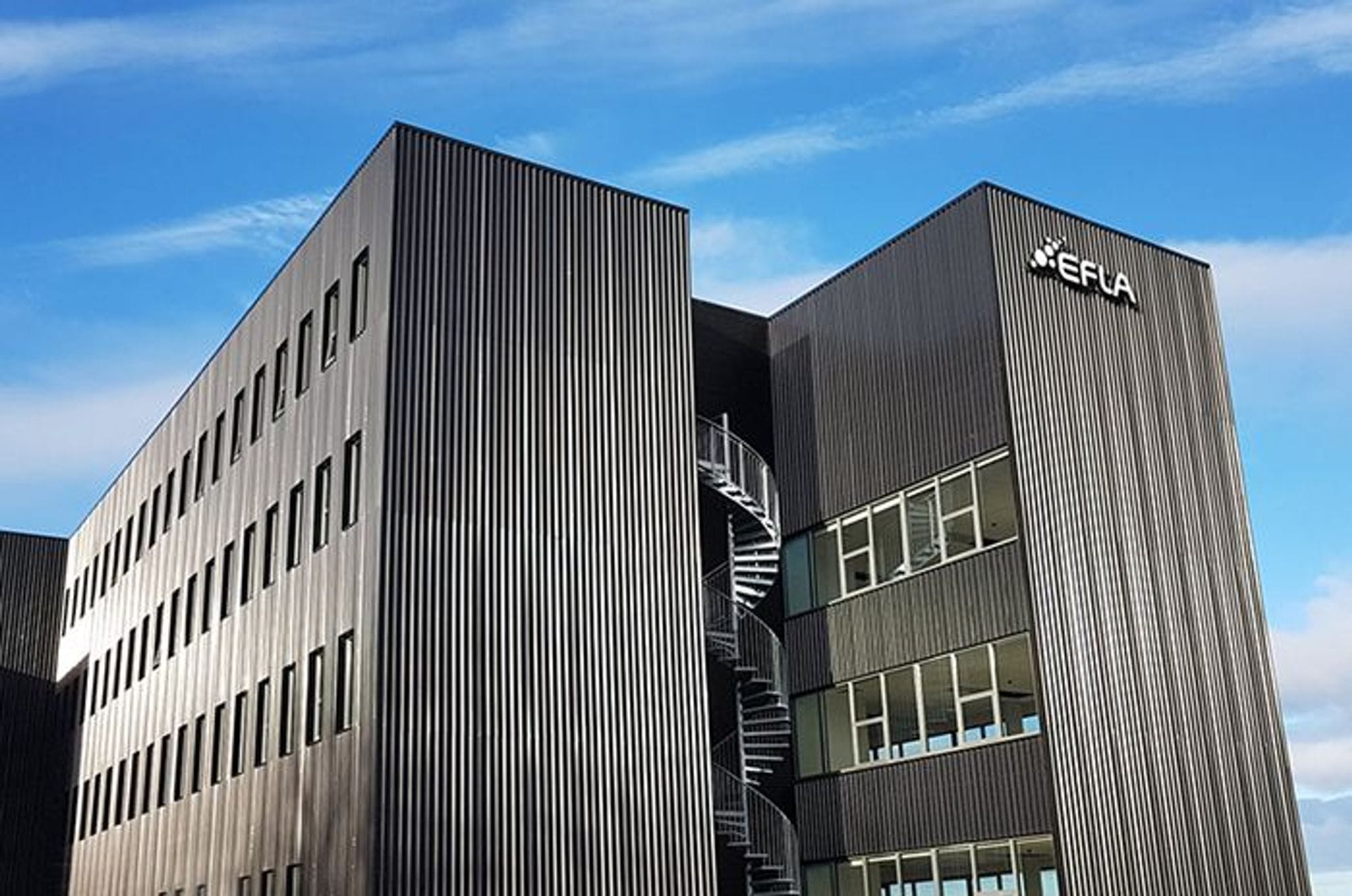 A modern building with vertical lines on its facade with EFLA company logo