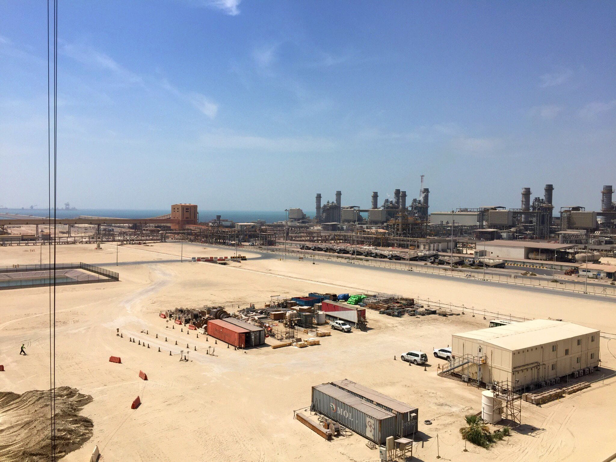 Industrial site with multiple structure and storage near a coastline