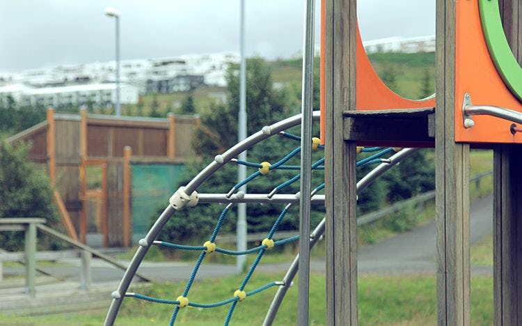 close up shot of climbing structure slide in a playground