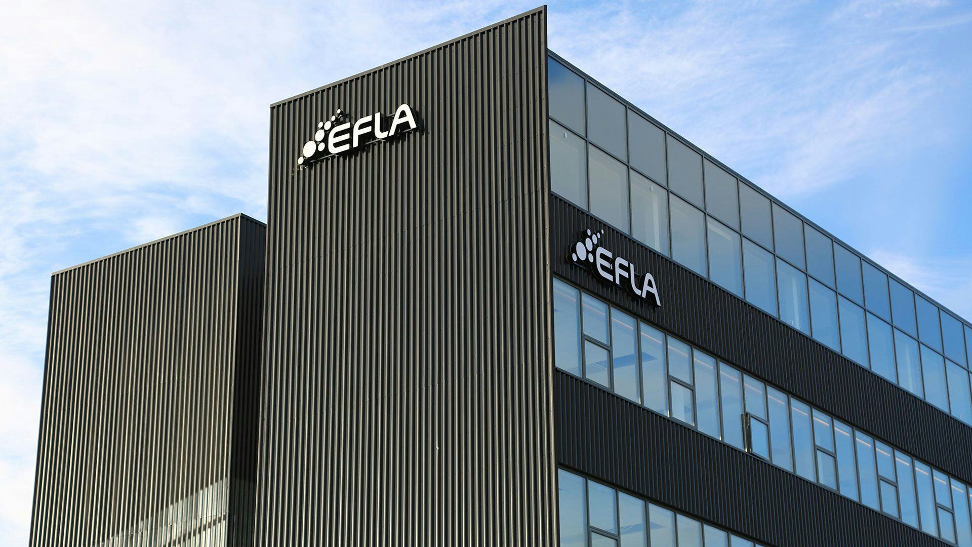 A modern building with vertical lines on its facade with EFLA company logo