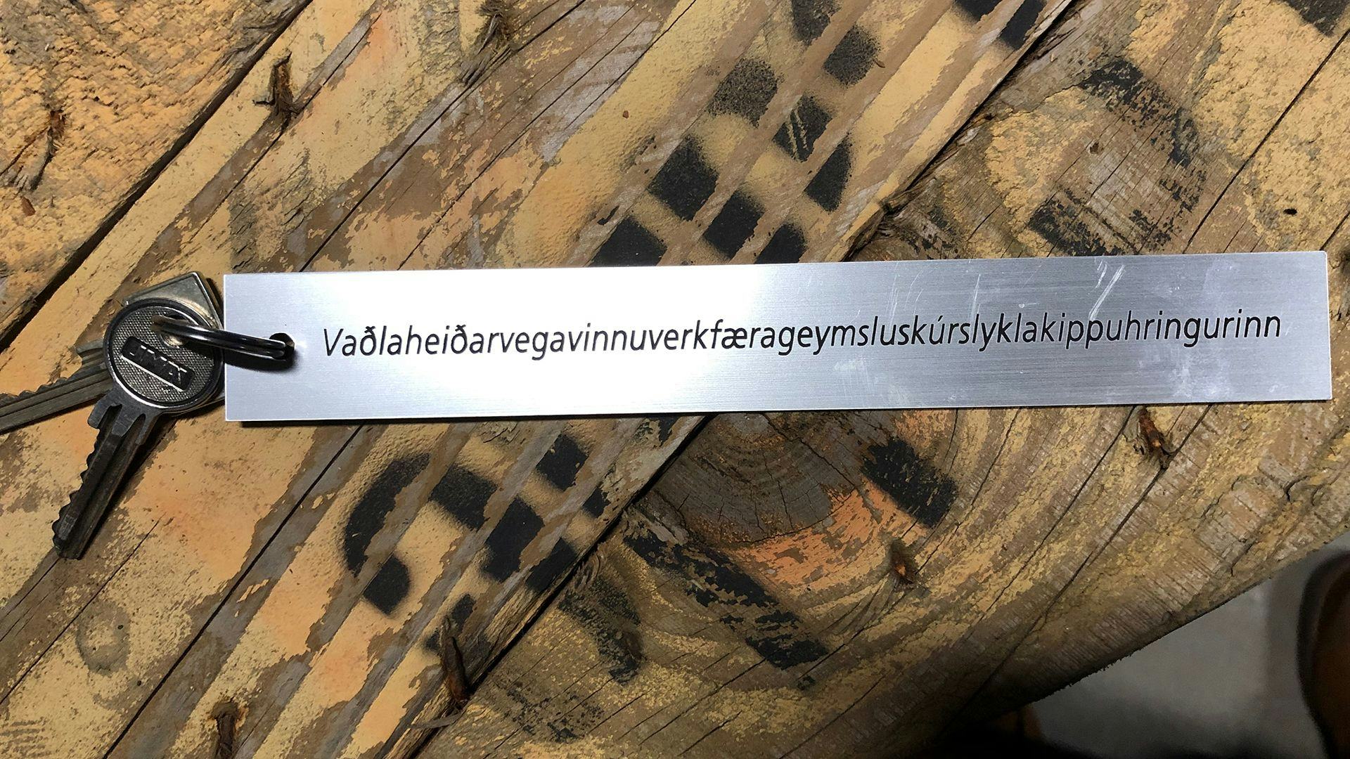 A long Icelandic text engraved on silver object attached to keys
