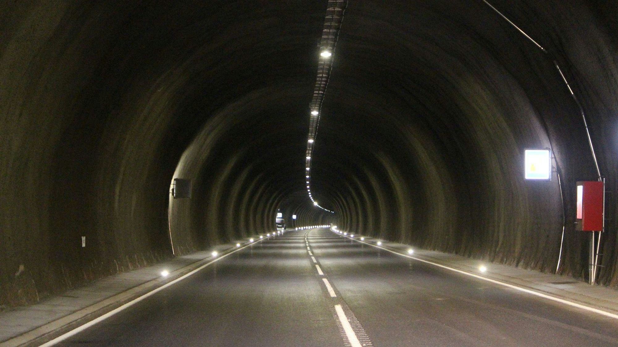 Interior of a tunnel with a well lit roadway