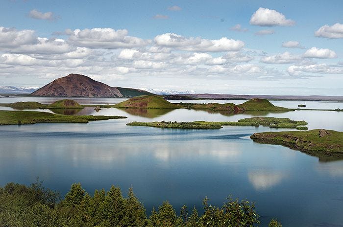 A landscape consist of serene lake and hills