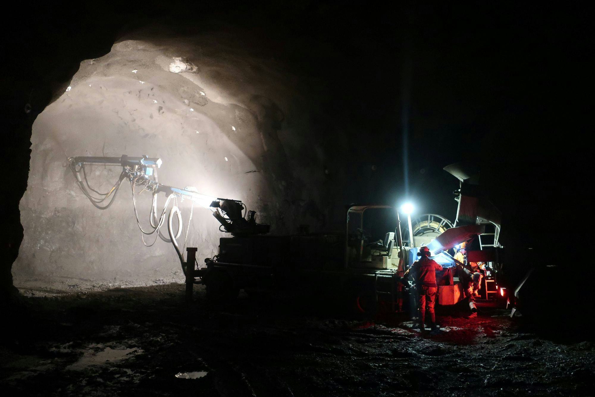 Dimly lit underground tunnel construction site