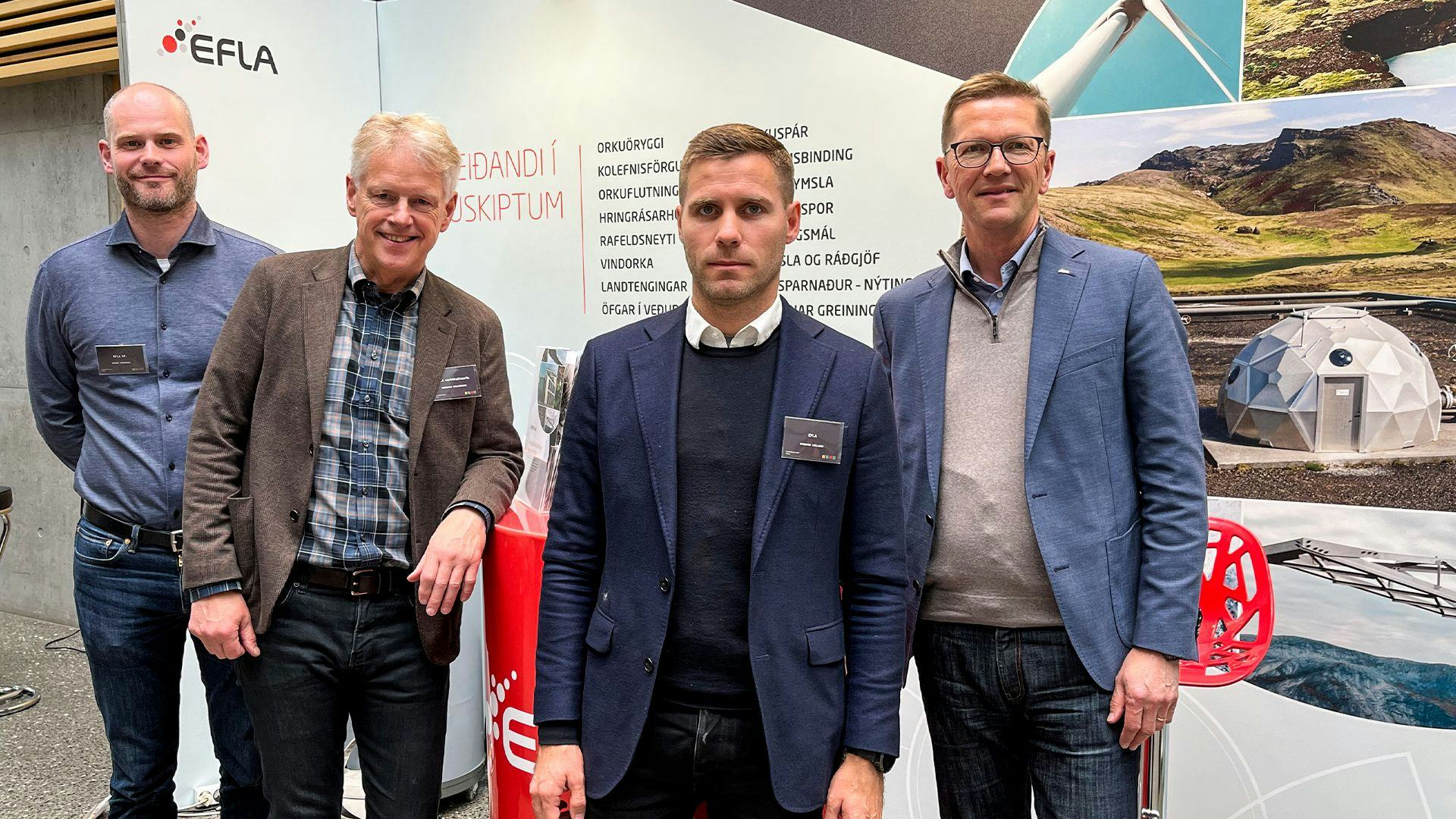 Four men standing in front of a backdrop with the EFLA logo and Icelandic text 