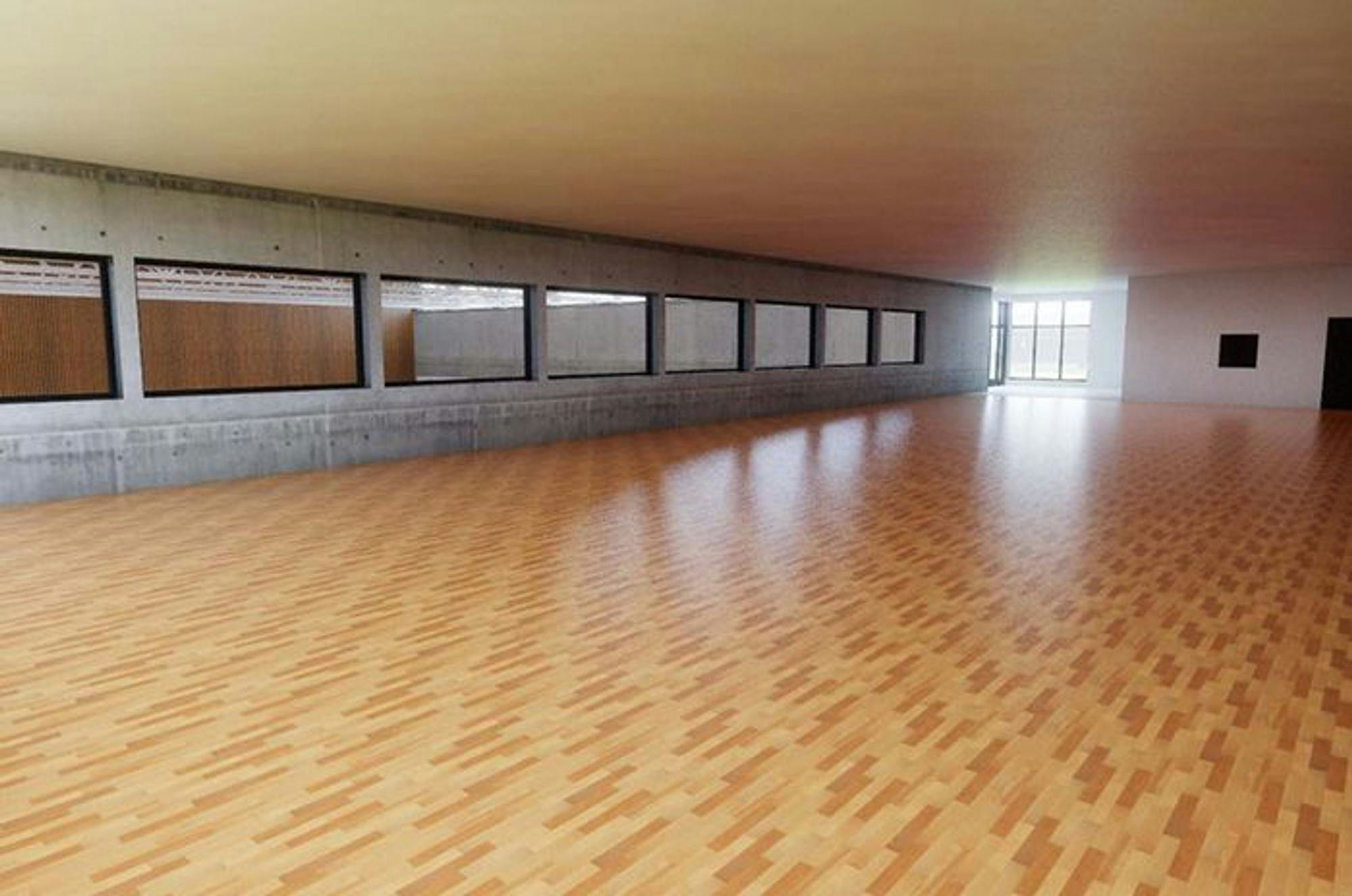 A spacious hall with a polished wooden floor and series of windows 