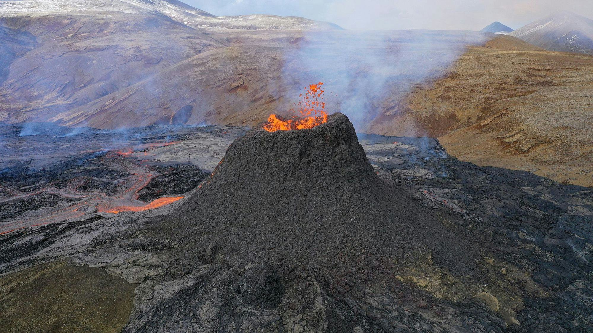 An active volcano eruption with lava flowing down the terrain, emitting smoke